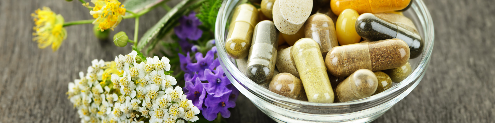 Flowers and bowl of supplements